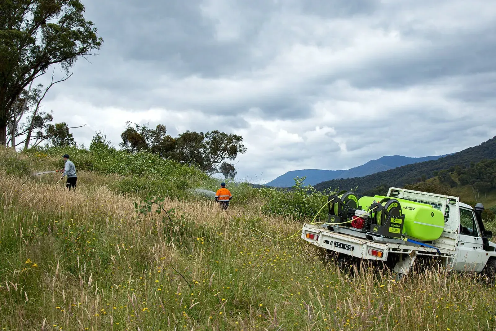 Vegetation management equipment working across an open property